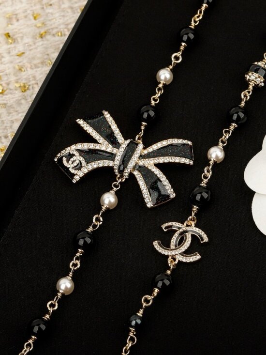 CHANEL Jewelry - Chanel Gold-Tone Black Enamel Crystal Bow CC Long Necklace
